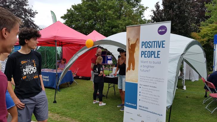 Roller banner with the Positive People logo