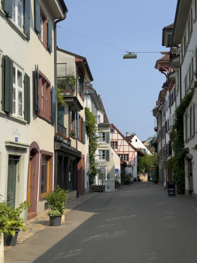 Photo of colourful houses on a street in Basel, Switzerland