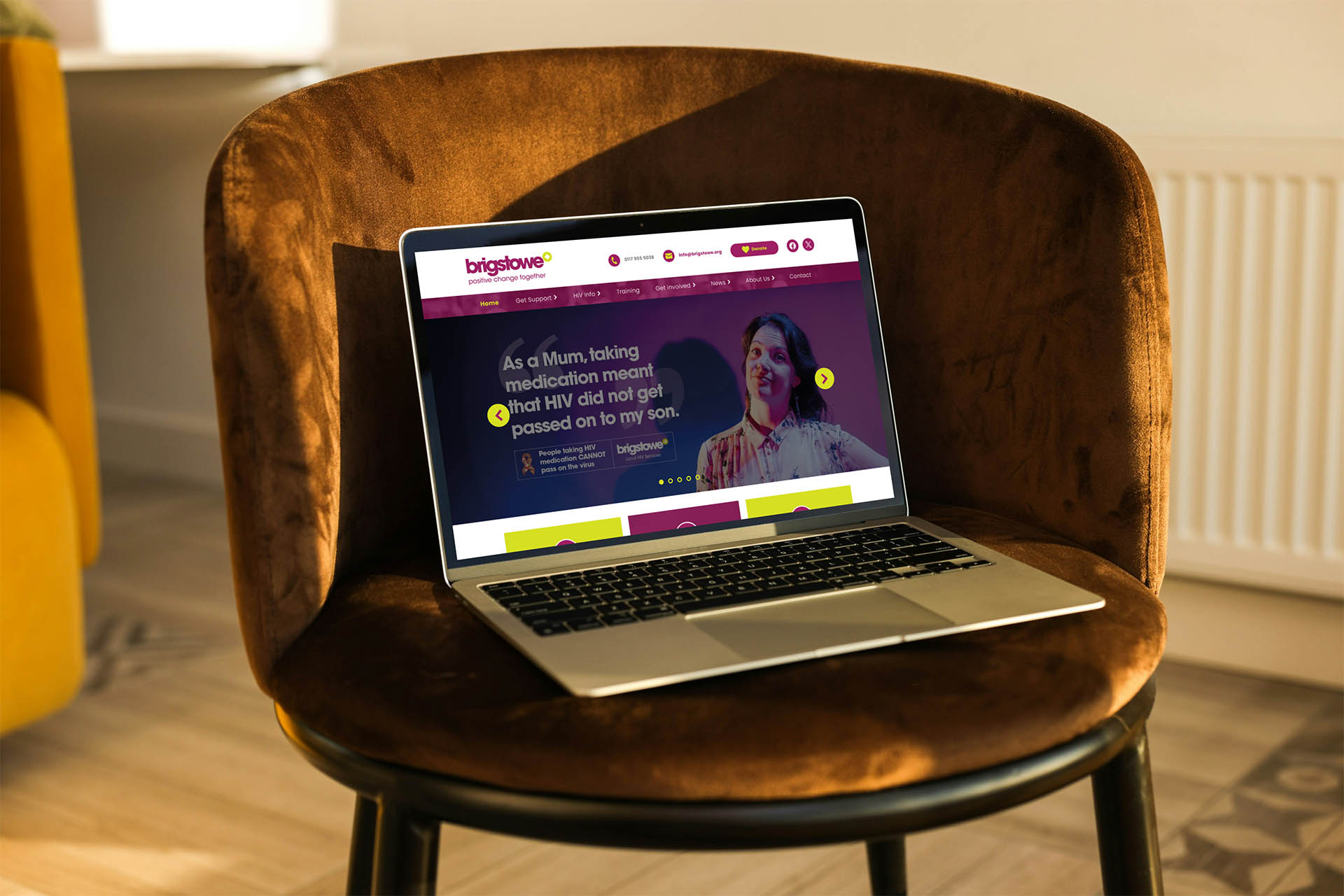 Laptop resting on a chair displaying the Brigstowe website