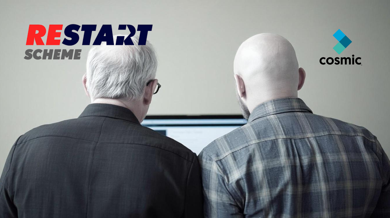 an image of two men, one older than other both looking at a laptop with restart and cosmic logos