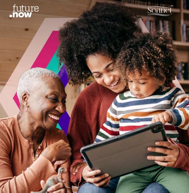 family including mother, grandmother and child looking at a whiteboard