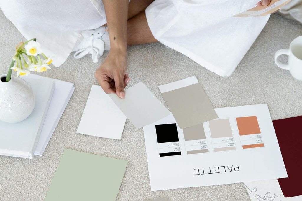 A person looking at colour swatches and branding options